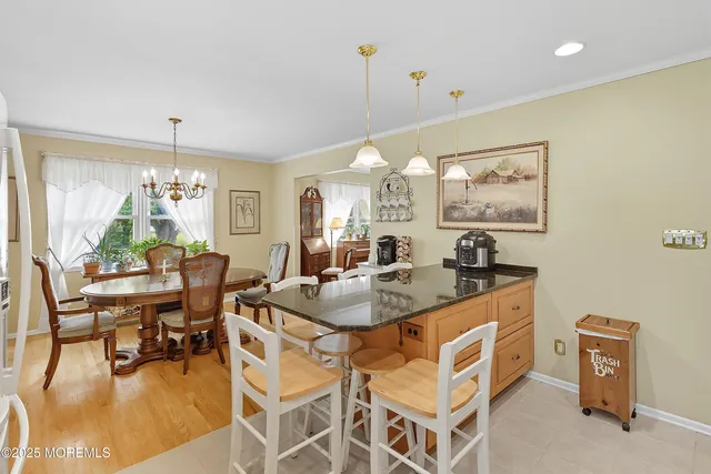 a dining room with a table and chairs