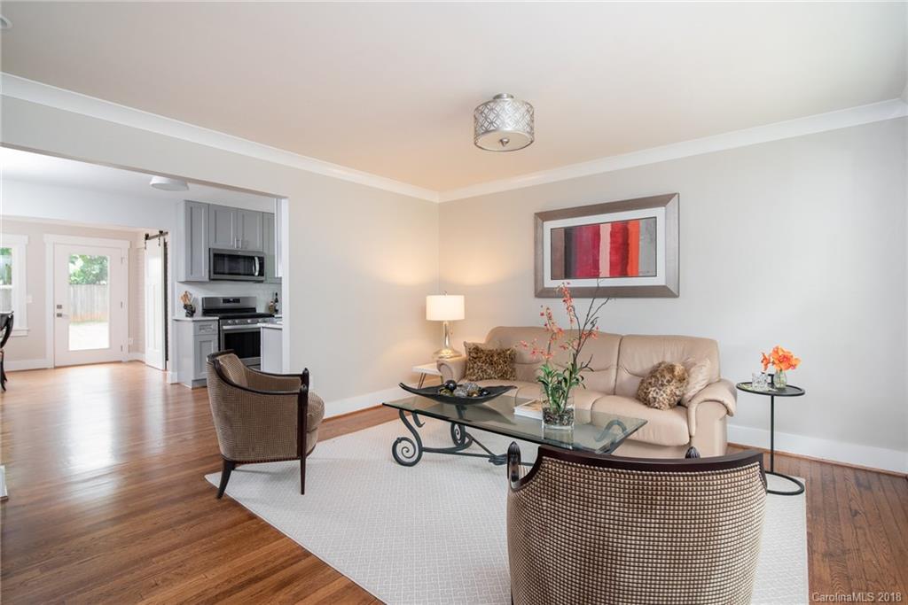 2431 Eaton Road Charlotte, NC 28205 - Photo 11 of 19 a living room with furniture and wooden floor
