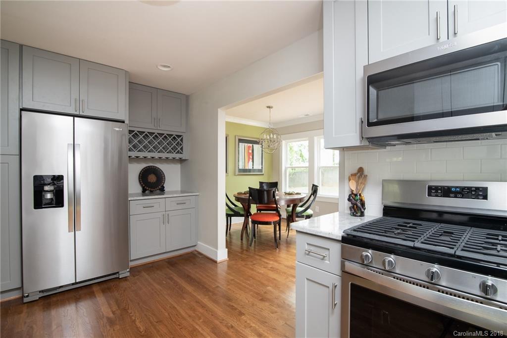 2431 Eaton Road Charlotte, NC 28205 - Photo 14 of 19 a kitchen with a stove and a refrigerator