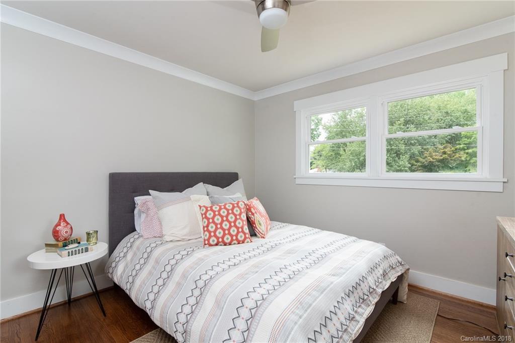 2431 Eaton Road Charlotte, NC 28205 - Photo 4 of 19 a bedroom with a bed and a window