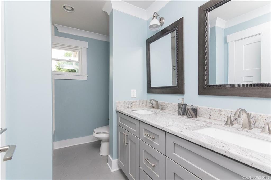 2431 Eaton Road Charlotte, NC 28205 - Photo 7 of 19 a bathroom with a granite countertop sink mirror and a toilet