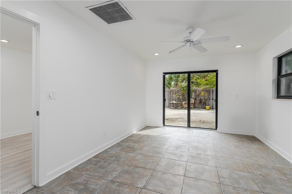 3301 31st Avenue Southwest Naples, FL 34117 - Photo 13 of 22 a view of an empty room with a window