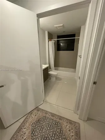 a kitchen with kitchen island a sink stainless steel appliances and cabinets