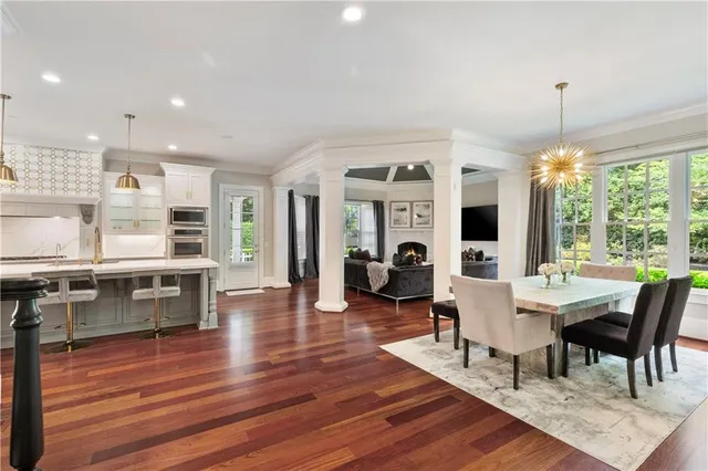 a living room with a fireplace furniture and a flat screen tv