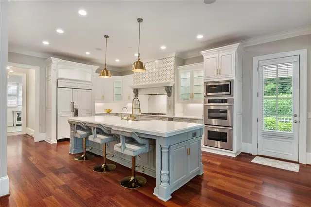 a living room with furniture a window and wooden floor