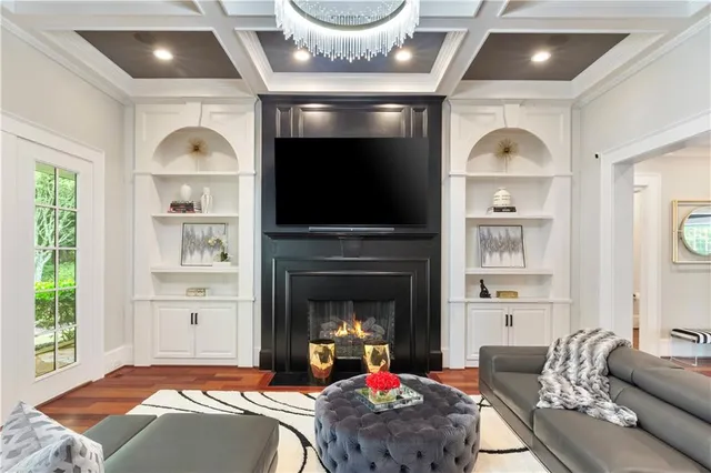 a spacious bathroom with a double vanity sink a large mirror and a bathtub