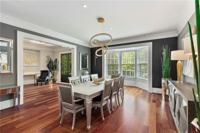 a bathroom with a toilet and a mirror
