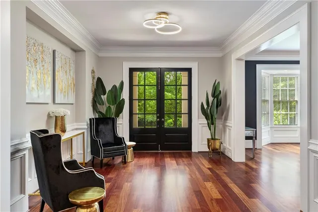 a view of a dining room with furniture wooden floor and a chandelier