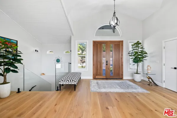 a spacious bedroom with bed and window