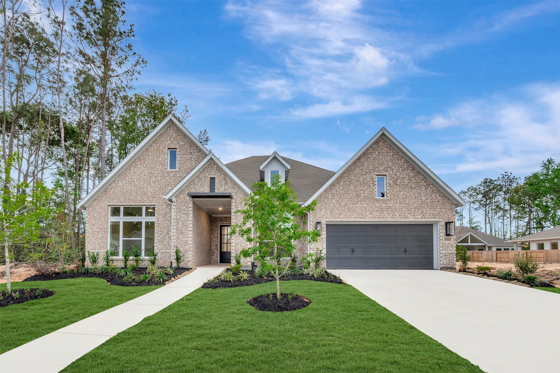 15722 Terracotta Terrace Conroe, TX 77302 - Photo 1 of 50 a front view of a house with a yard and garage