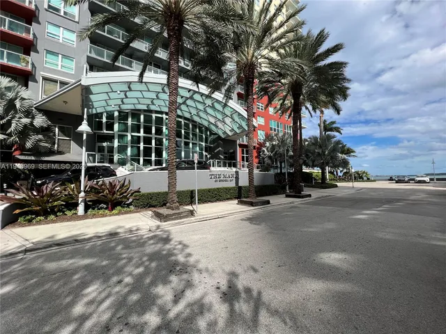a view of a street with a building in the background