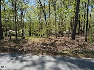 a view of outdoor space with deck and yard