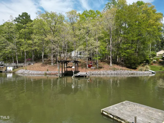 a view of a lake with a house in the background