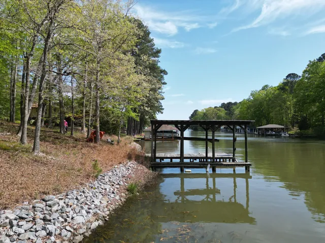 a swimming pool view with a outdoor seating