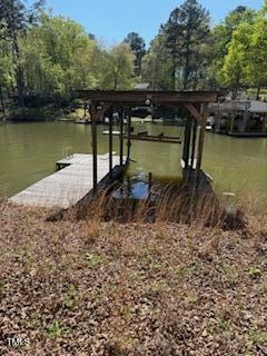 492 Richmond Road Henrico, NC 27842 - Photo 9 of 17 a view of a lake with a car parked