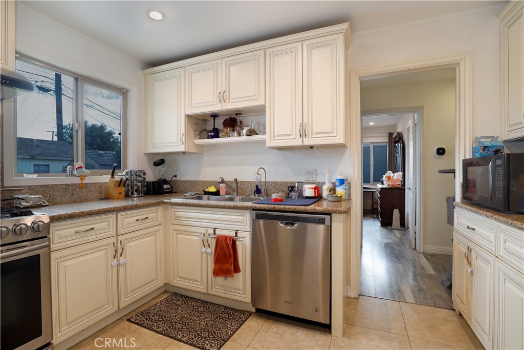 15040 Root Street Baldwin Park, CA 91706 - Photo 13 of 23 a kitchen with a sink and cabinets