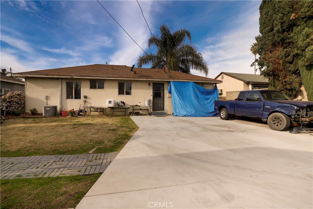 15040 Root Street Baldwin Park, CA 91706 - Photo 18 of 23 a front view of a house with a yard