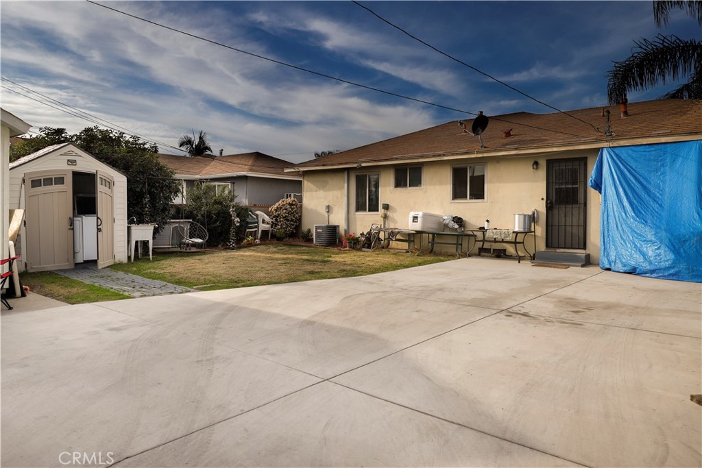 15040 Root Street Baldwin Park, CA 91706 - Photo 19 of 23 a front view of a house with a yard and garage