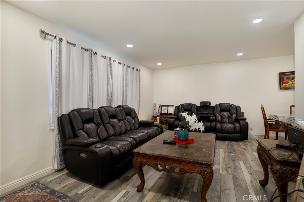15040 Root Street Baldwin Park, CA 91706 - Photo 7 of 23 a living room with furniture and wooden floor