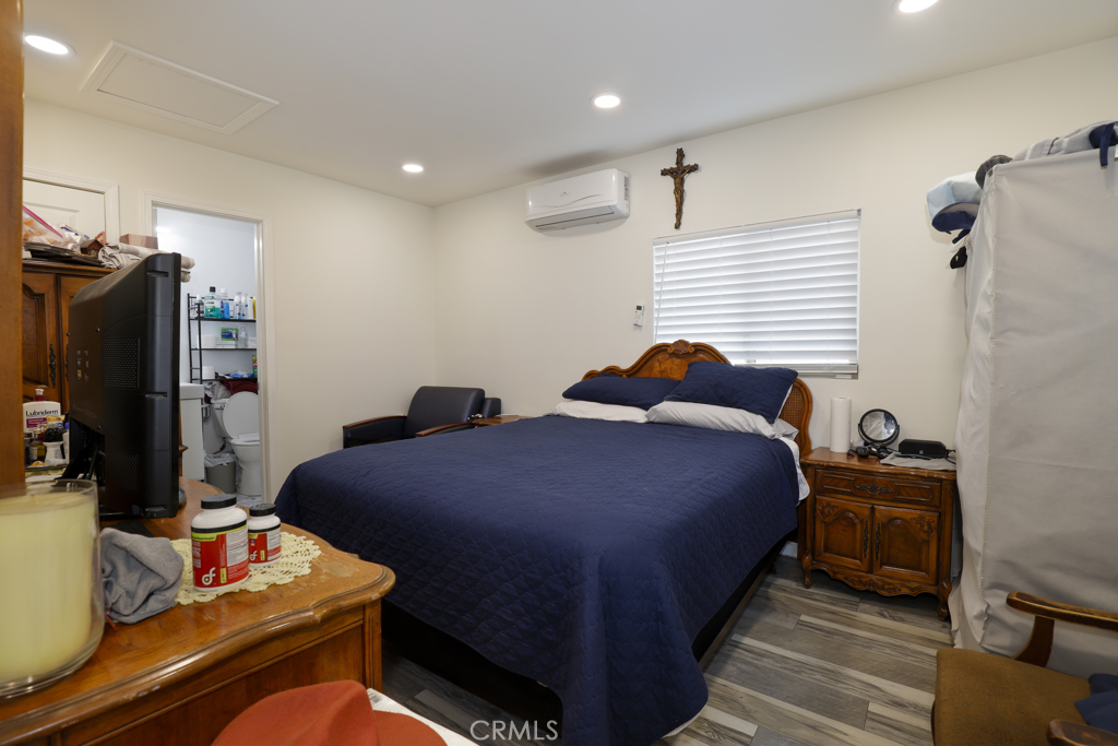 15040 Root Street Baldwin Park, CA 91706 - Photo 8 of 23 a bed room with a bed and a television