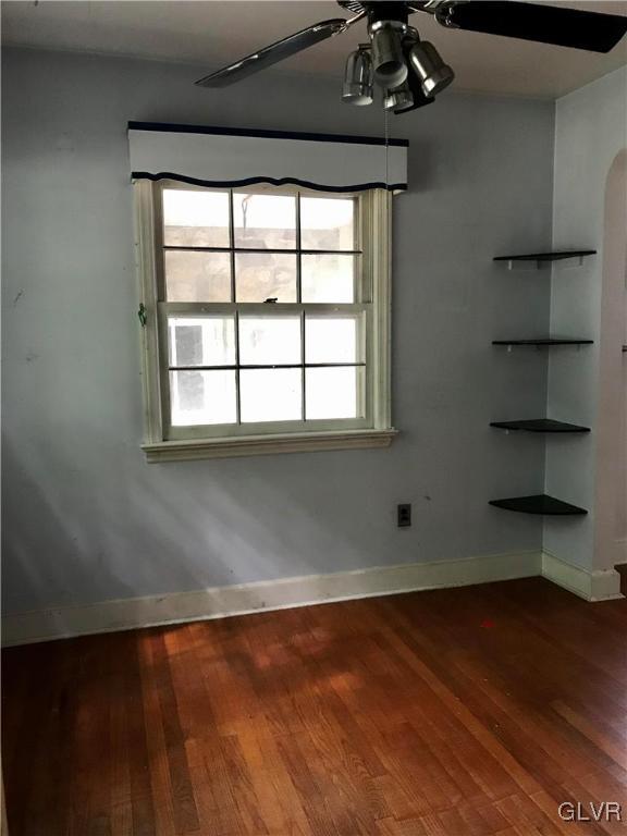 185 Tanite Road Stroudsburg, PA 18360 - Photo 10 of 32 an empty room with wooden floor and windows