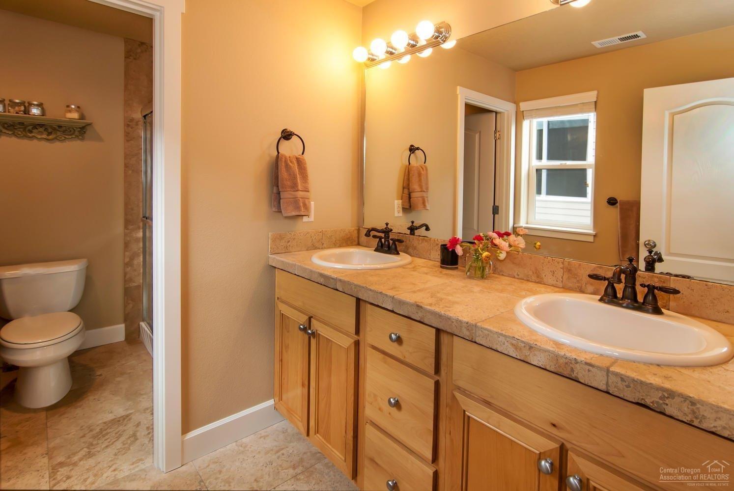 20725 Kilbourne Loop Bend, OR 97701 - Photo 10 of 22 The master bath features dual vanities,