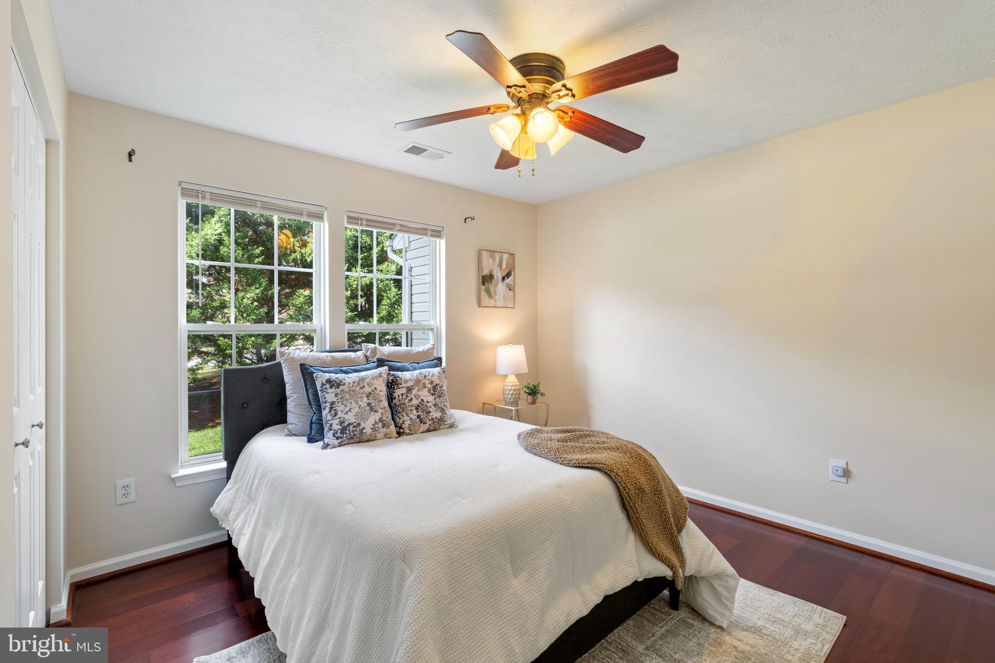 9602 Haven Farm Road, Unit 9602B Perry Hall, MD 21128 - Photo 13 of 37 a bedroom with a large bed and a large window