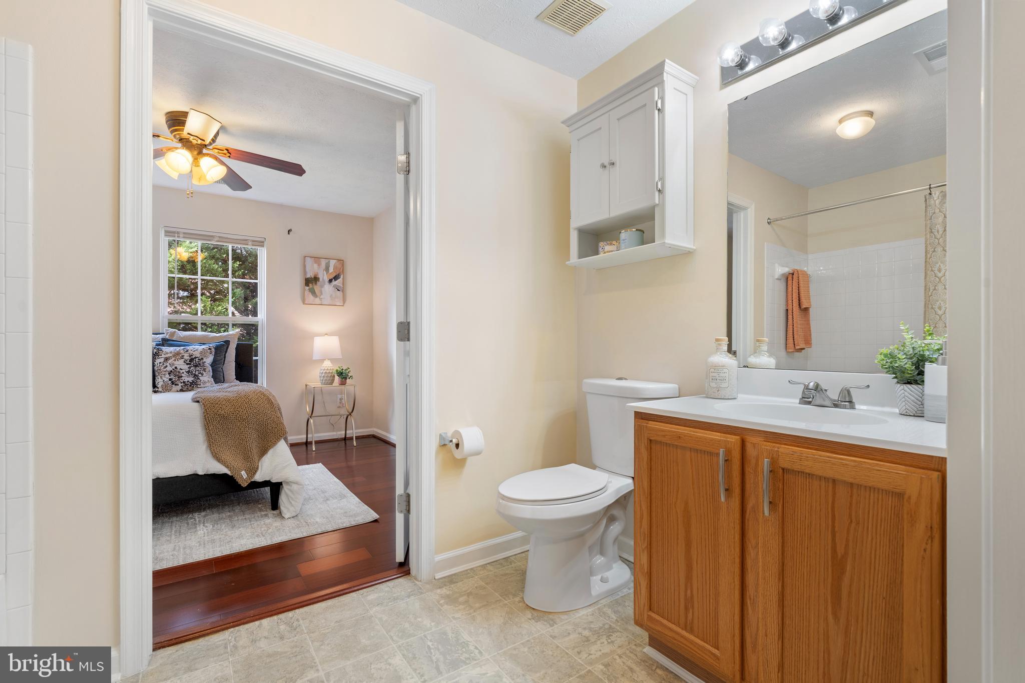 9602 Haven Farm Road, Unit 9602B Perry Hall, MD 21128 - Photo 14 of 37 a bathroom with a sink toilet and mirror