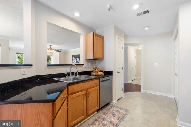 a kitchen with stainless steel appliances a refrigerator stove and microwave