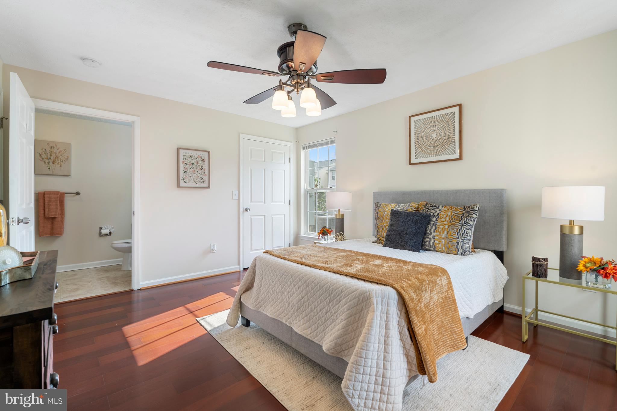 9602 Haven Farm Road, Unit 9602B Perry Hall, MD 21128 - Photo 25 of 37 a spacious bedroom with a bed and a chandelier