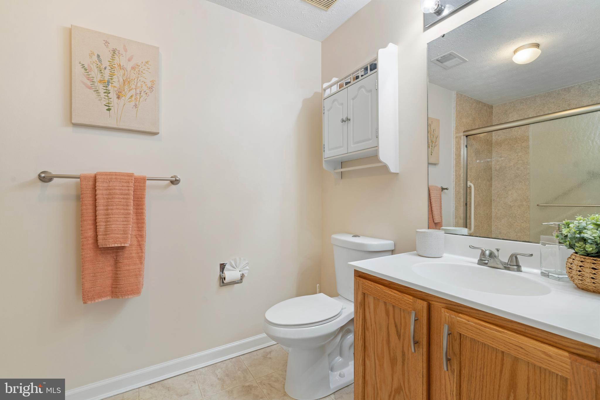 9602 Haven Farm Road, Unit 9602B Perry Hall, MD 21128 - Photo 26 of 37 a bathroom with a sink a toilet and shower
