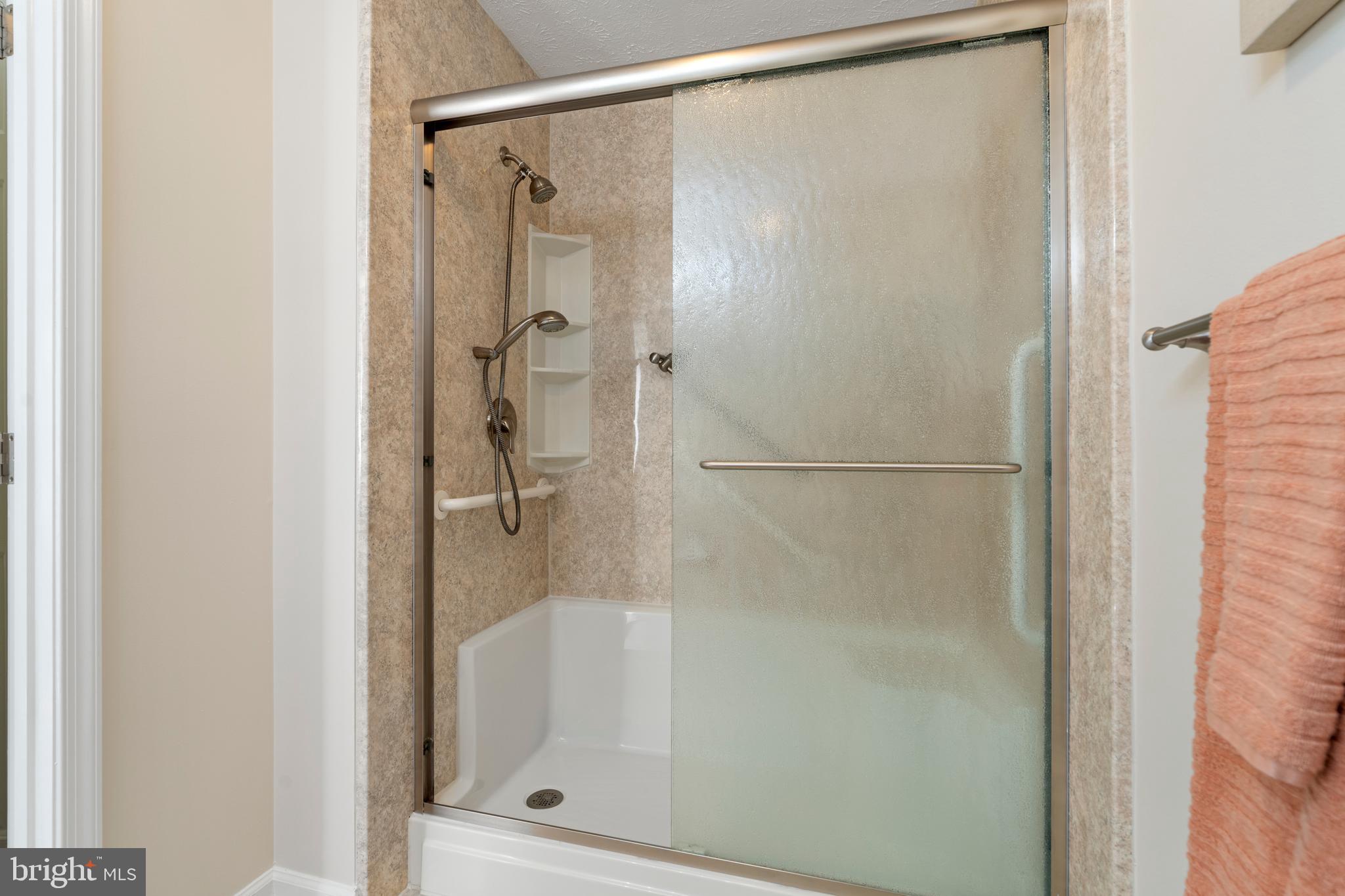 9602 Haven Farm Road, Unit 9602B Perry Hall, MD 21128 - Photo 27 of 37 a bathroom with a glass shower door