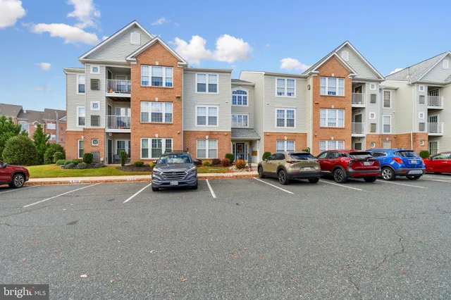 a view of a car parked in front of a brick building