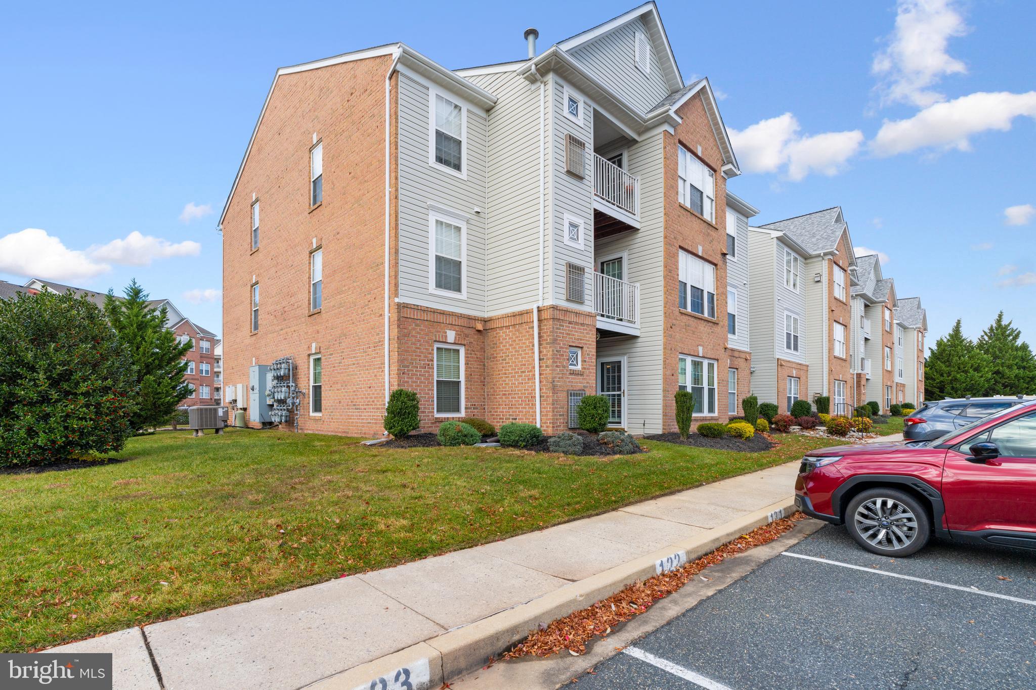 9602 Haven Farm Road, Unit 9602B Perry Hall, MD 21128 - Photo 33 of 37 a view of a car parked in front of a brick building