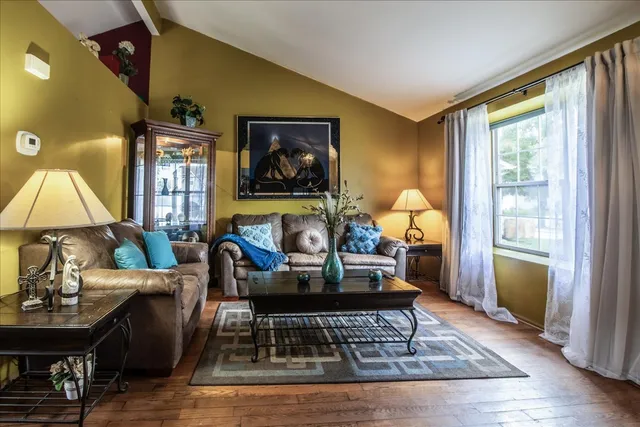 a living room with furniture and a window