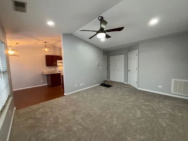 a view of a livingroom with a kitchen