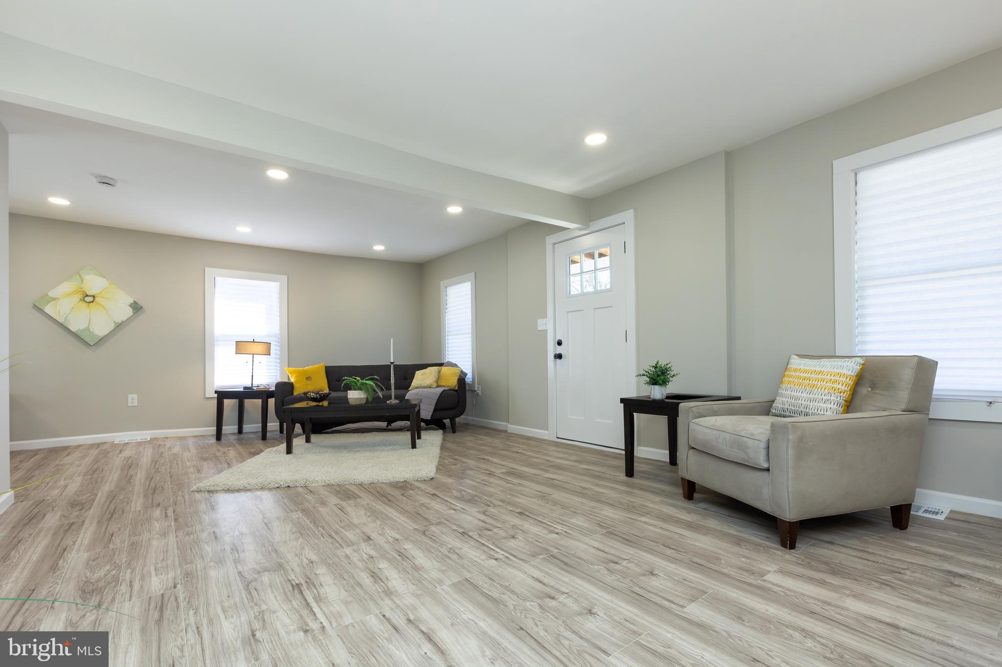 2407 Hammonds Ferry Road Halethorpe, MD 21227 - Photo 21 of 43 a living room with furniture and a wooden floor