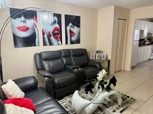 a living room with furniture gym equipment and a couch