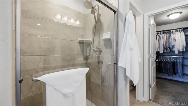 a bathroom with a sink and shower