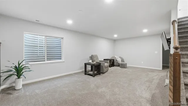 a view of work space with furniture and a window