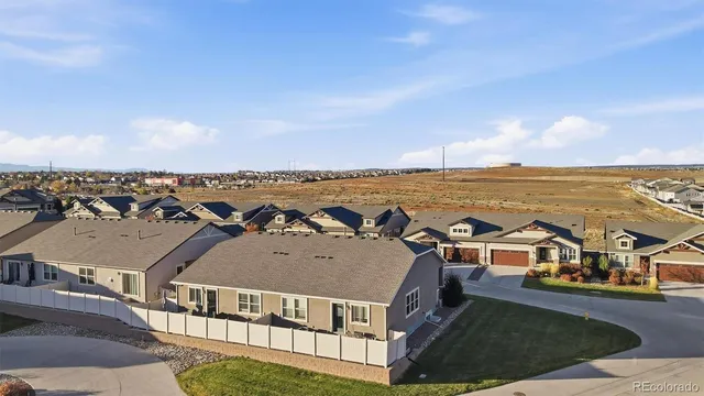 an aerial view of a house with a ocean view