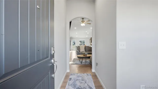 a bathroom with a sink and mirror with shower