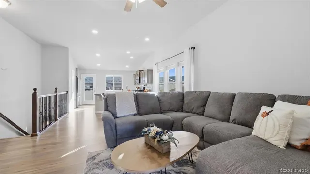 a living room with furniture and a table