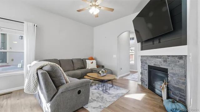 a living room with furniture and a fireplace