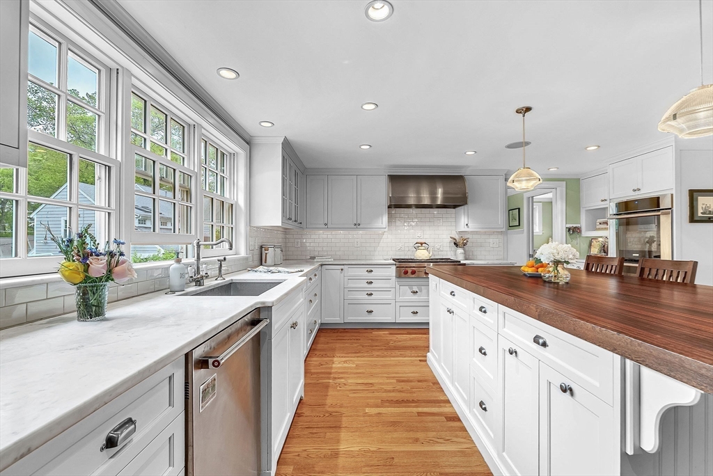 2 Woodway Road Wellesley, MA 02482 - Photo 13 of 39 a kitchen with stainless steel appliances a sink stove and cabinets