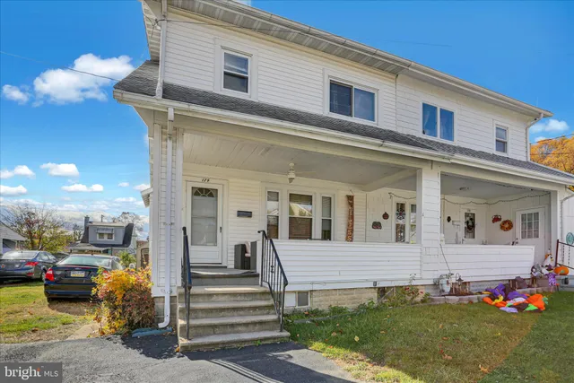 a view of a building with car parked