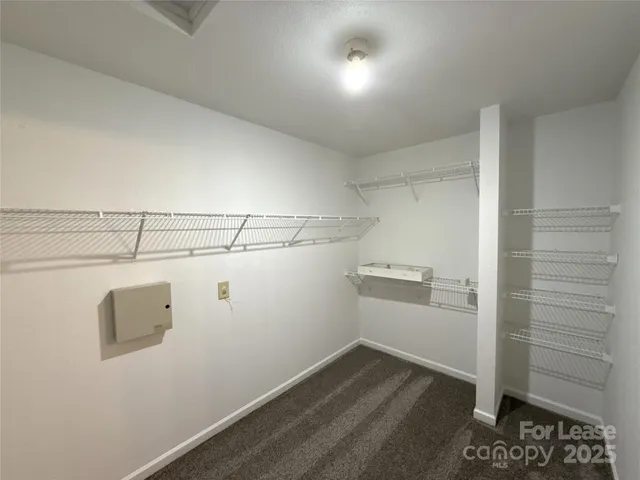 a view of a room with racks on the wall