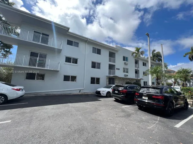 a cars parked in front of a building
