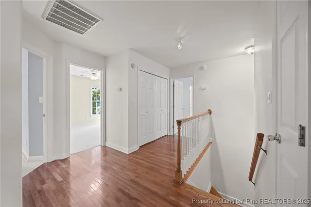 a view of empty room with a fireplace