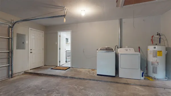 a view of a storage & utility room with a sink